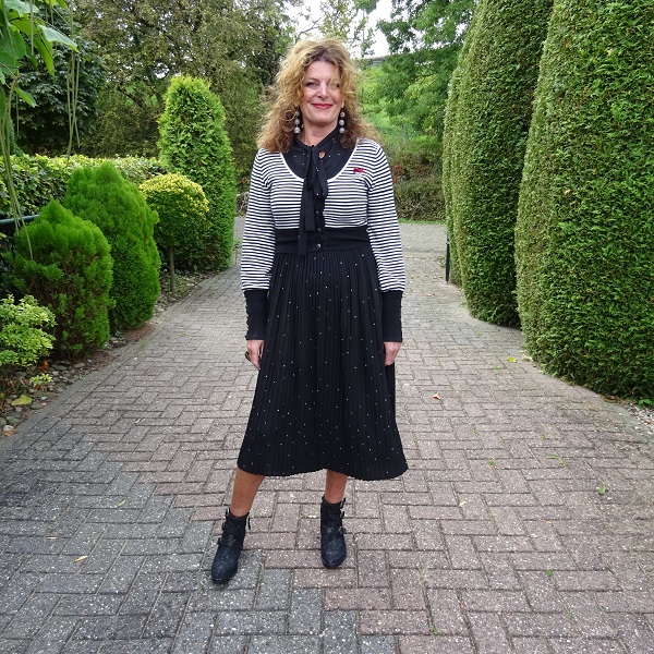 pleated skirt dress and cowboy boots