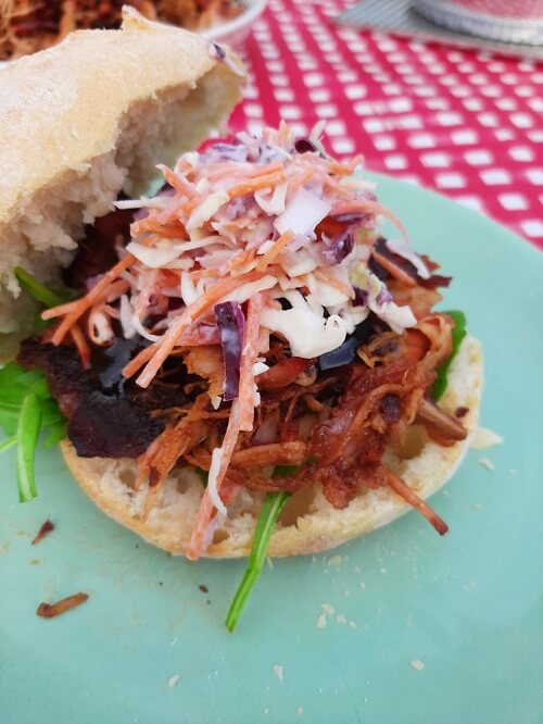 rolll with coleslaw and pulled pork