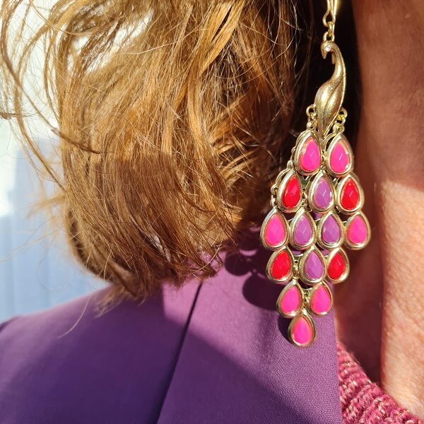 statement earrings in purple shades