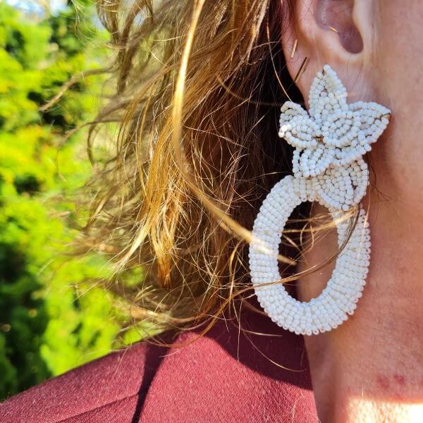 white beaded statement earrings