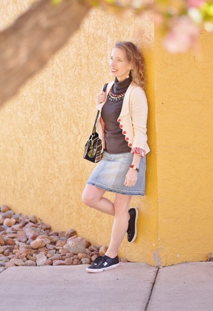 fashion blogger in denim mini skirt