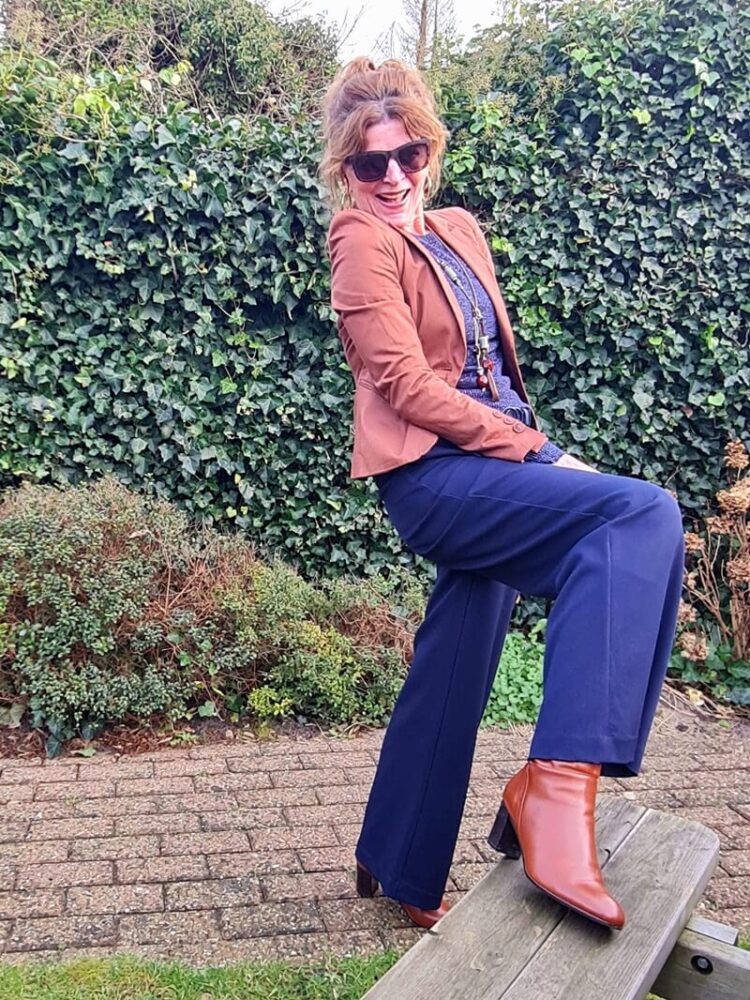 brown boots under navy trousers