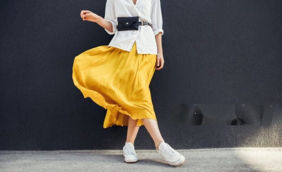 white sneakers and yellow skirt