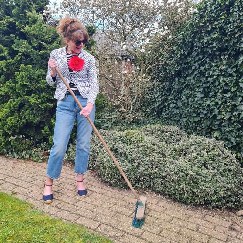 fun photo of a fashion blogger at work in garden
