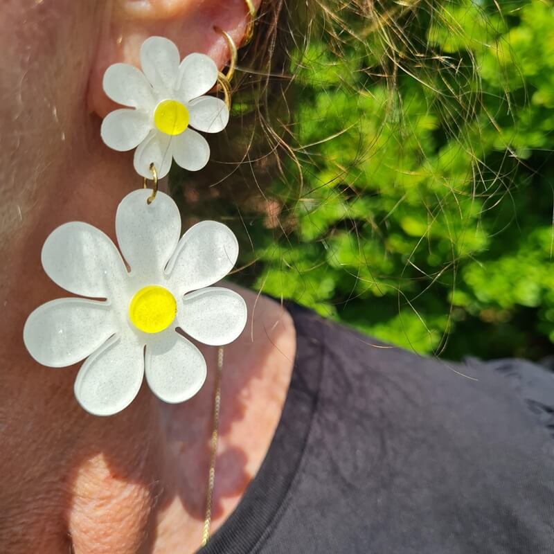 white and yellow earrings