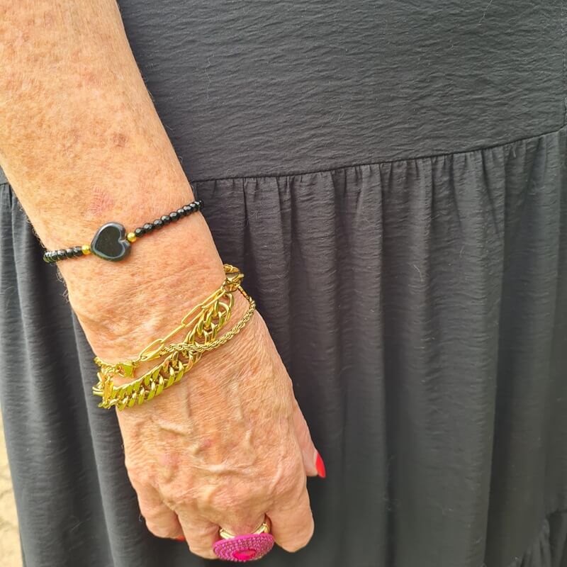 golden and black bracelets