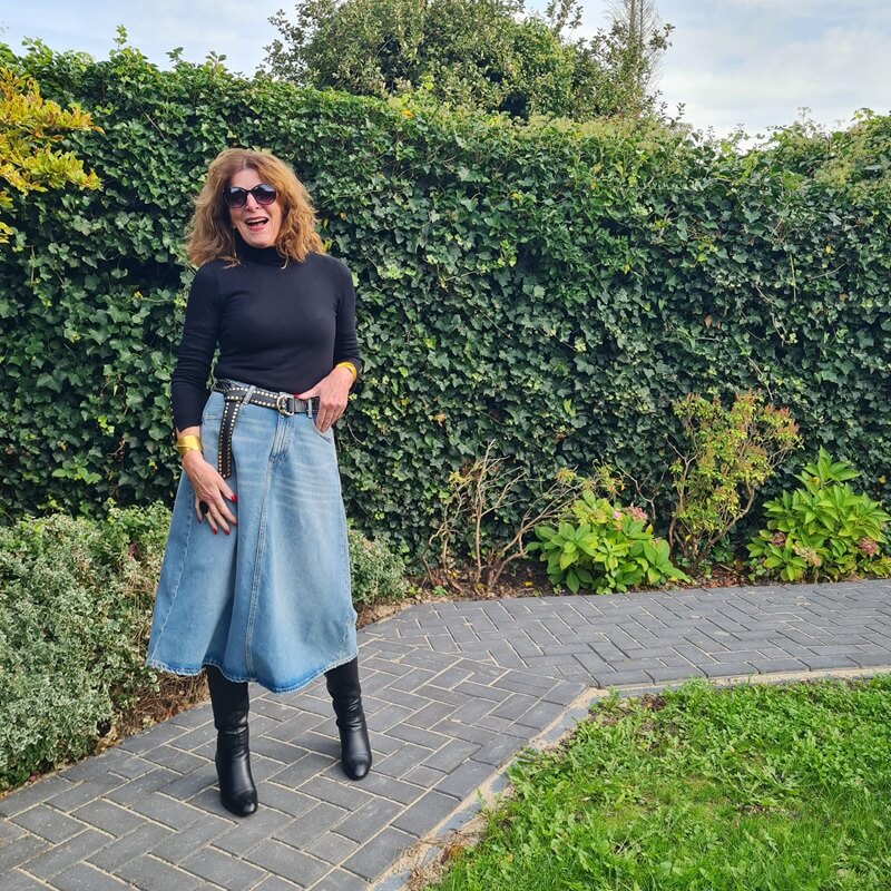 denim skirt and black leather boots