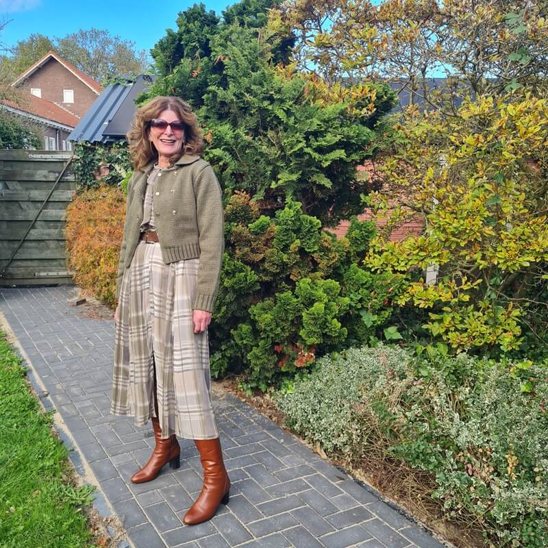 green cardigan on a grey and green dress