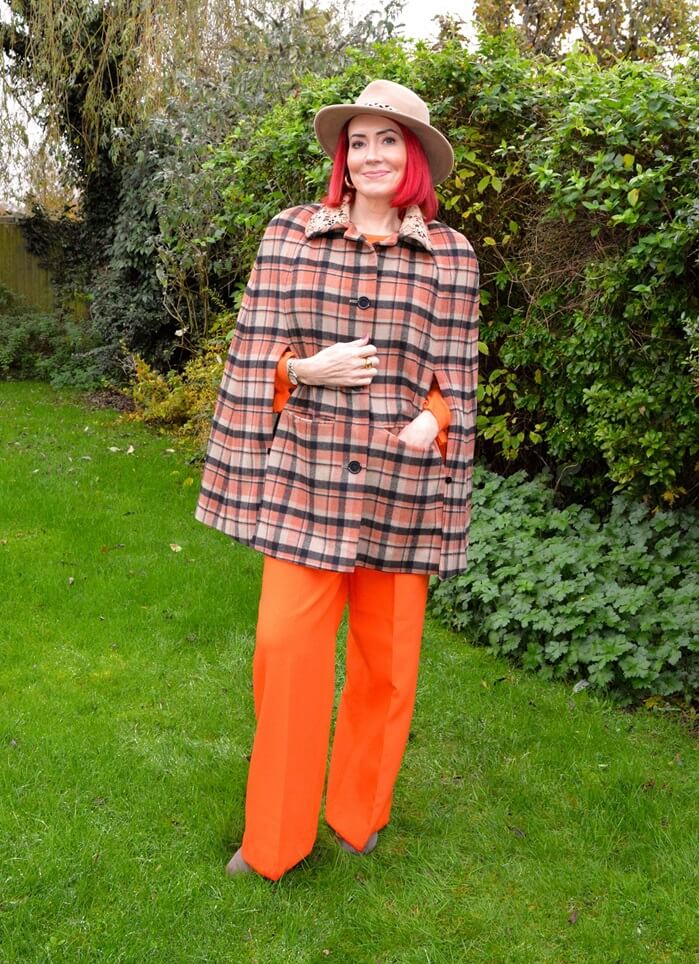 orange cape on orange trousers
