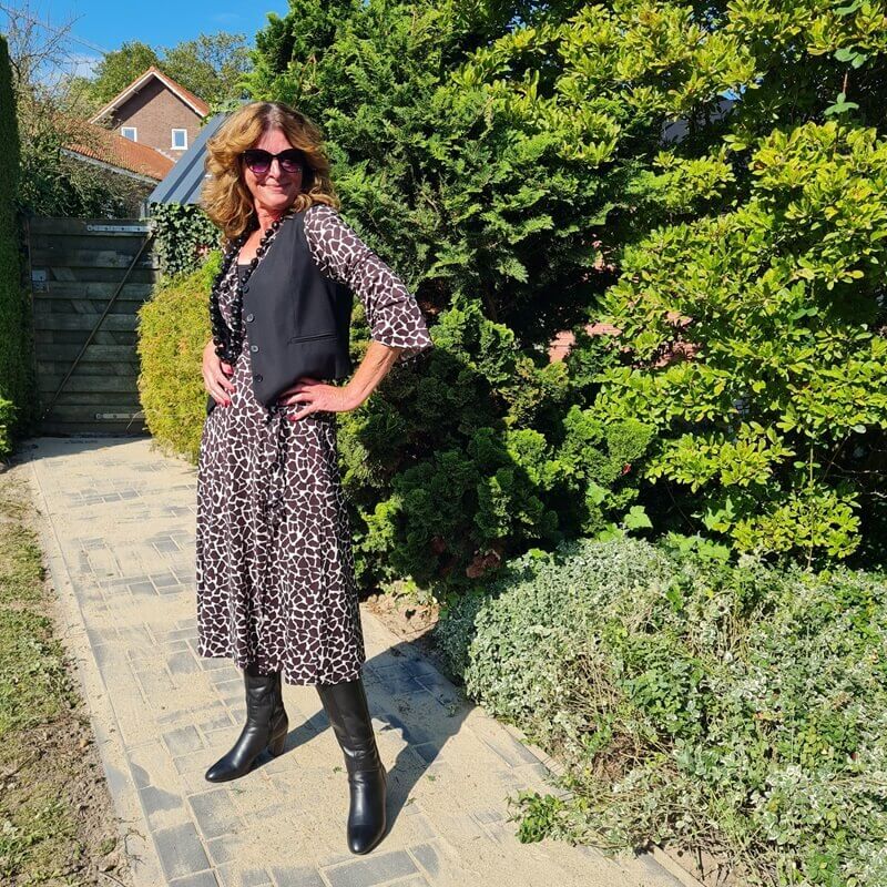 black waistcoat on a brown and cream dress