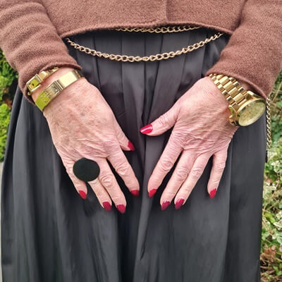 golden jewelry and black statement ring