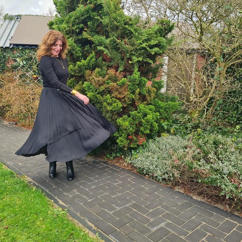 pleated skirt and a knit jumper