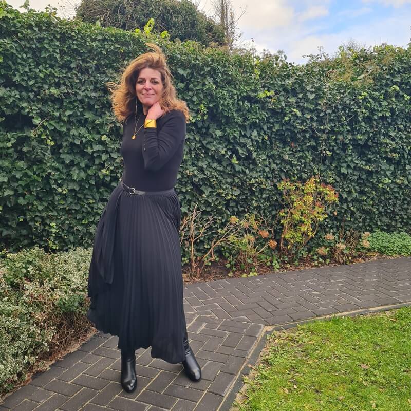 My go-to: monochrome black with a pleated skirt