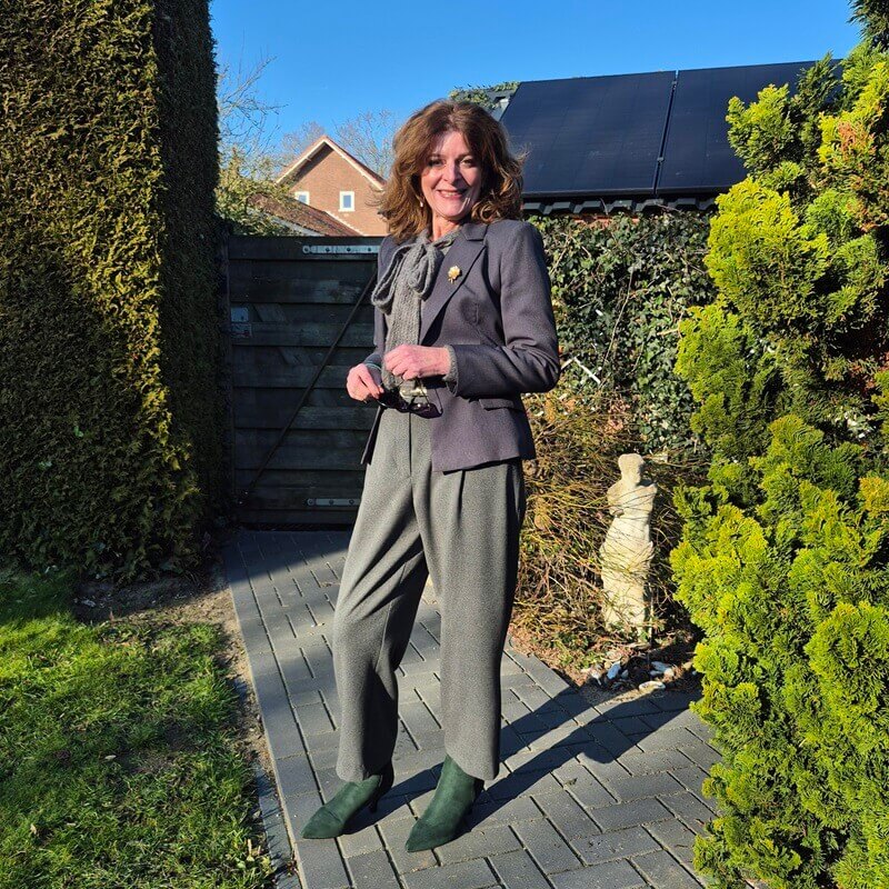 grey trousers and green ankle boots