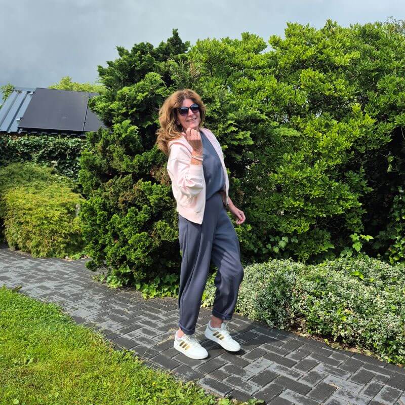 white sneakers under grey joggers