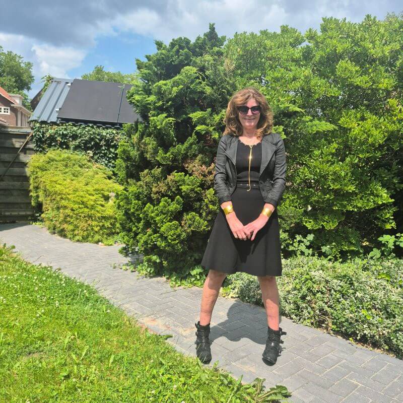 black dress with bikerjacket and ankle boots