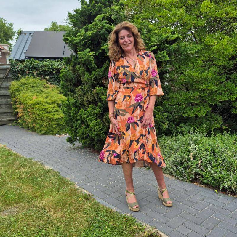 wrap dress in orange pink and green