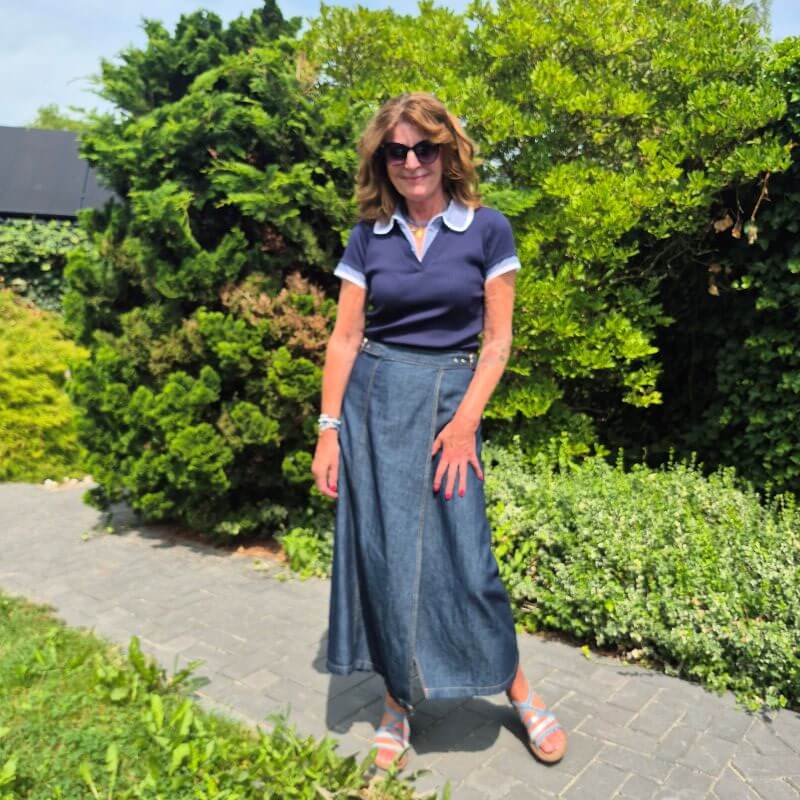 polo-neck blue top with checkered details