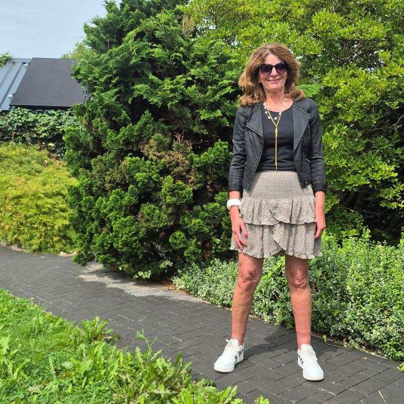 mini skirt with biker jacket and sneakers