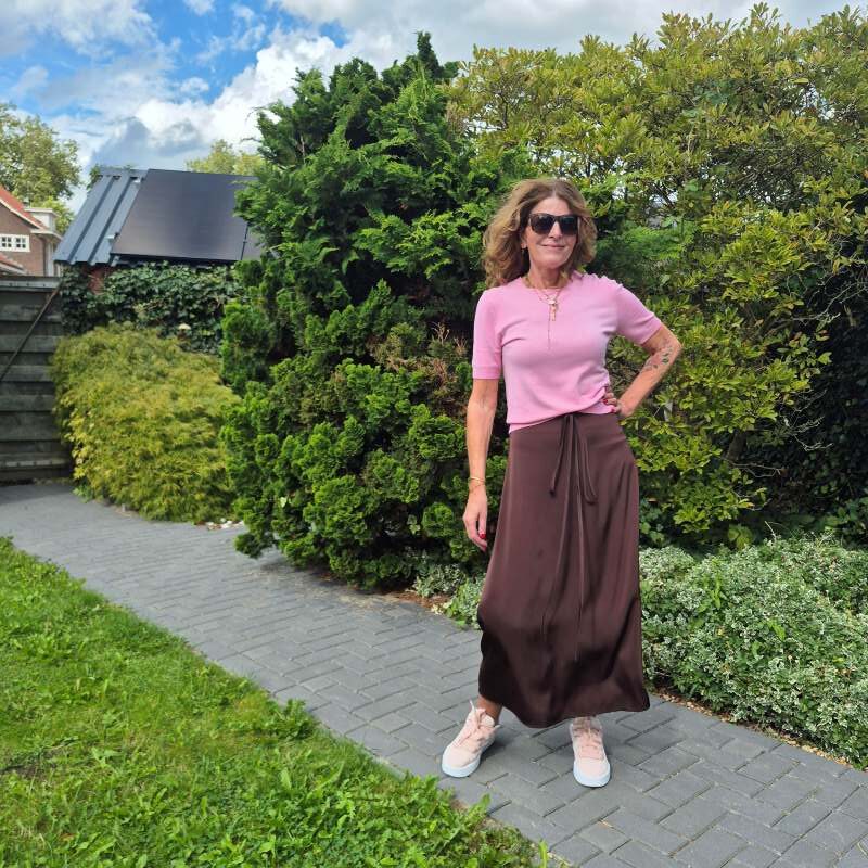 pink and brown outfit with a silk skirt