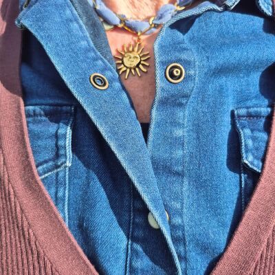 blue necklace with golden sun