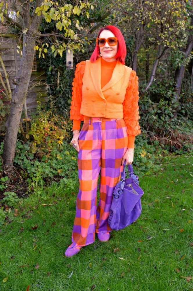 vested in orange and purple