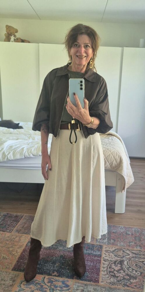 brown bomber with green top and flowy skirt, the highlight of the week